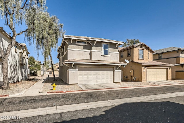 view of front facade with a garage and stucco siding