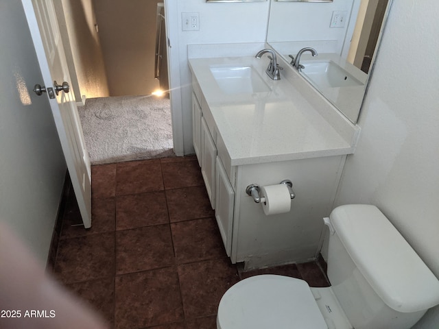 bathroom featuring vanity, toilet, and tile patterned floors