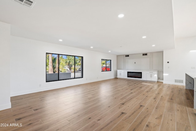 unfurnished living room featuring light hardwood / wood-style floors