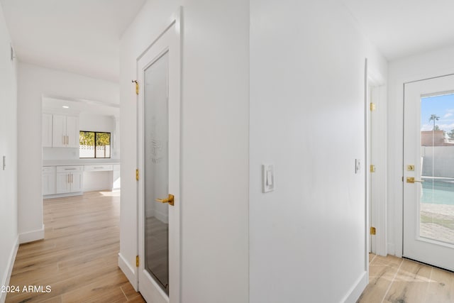 corridor featuring light hardwood / wood-style floors