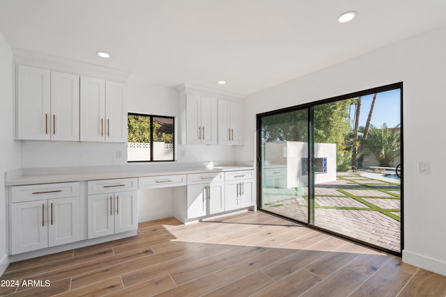 kitchen with white cabinetry and light wood-type flooring