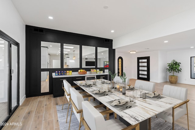 dining space with light wood-type flooring