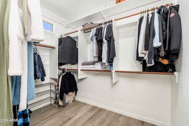 spacious closet featuring light hardwood / wood-style flooring