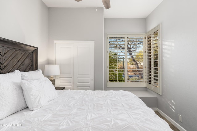 bedroom featuring ceiling fan and a closet