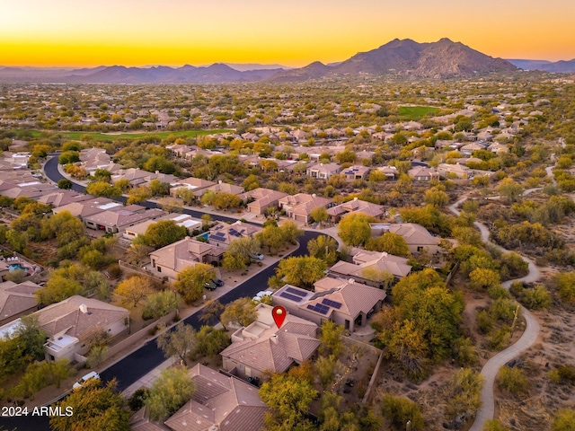 aerial view at dusk with a mountain view