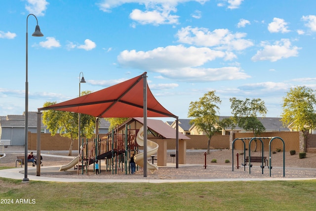 view of playground featuring a lawn