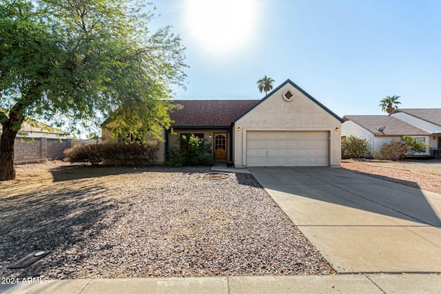 single story home featuring a garage