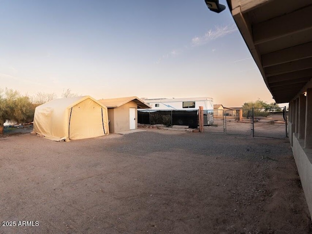 1705 S Cedar Dr, Apache Junction, AZ 85120 - yard at dusk with a gate