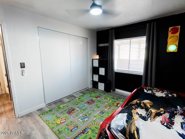 1705 S Cedar Dr, Apache Junction, AZ 85120 - bedroom featuring light wood-style floors, a closet, and a ceiling fan