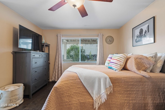 bedroom featuring dark wood-type flooring and ceiling fan