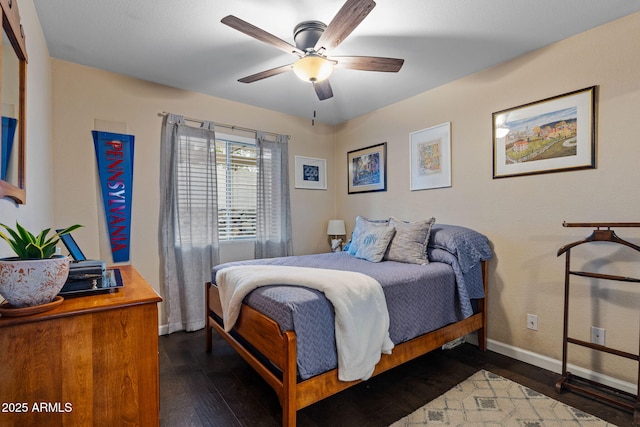 bedroom featuring dark hardwood / wood-style floors and ceiling fan