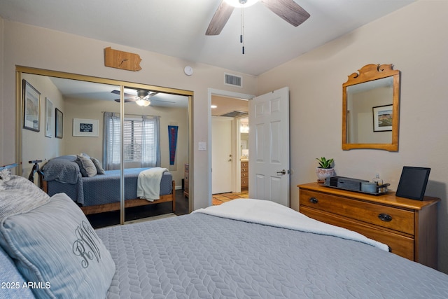 bedroom with ceiling fan and a closet