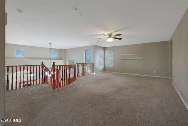 carpeted empty room with ceiling fan