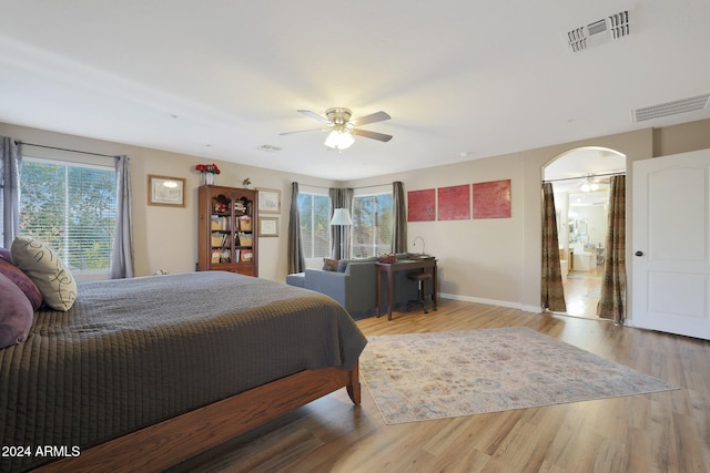 bedroom with hardwood / wood-style floors and ceiling fan