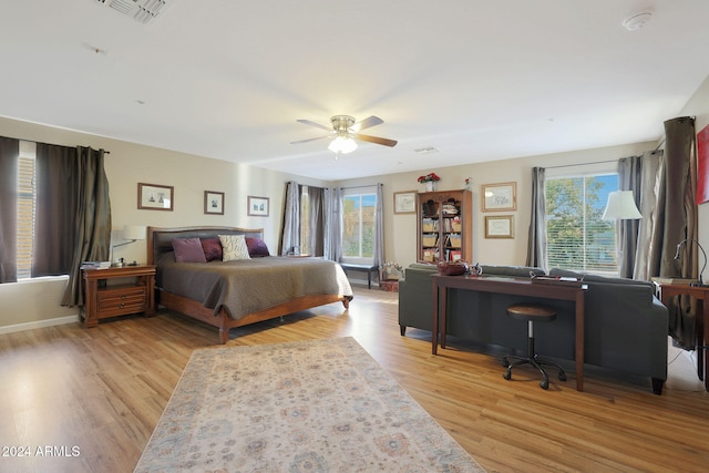 bedroom with light wood-type flooring and ceiling fan