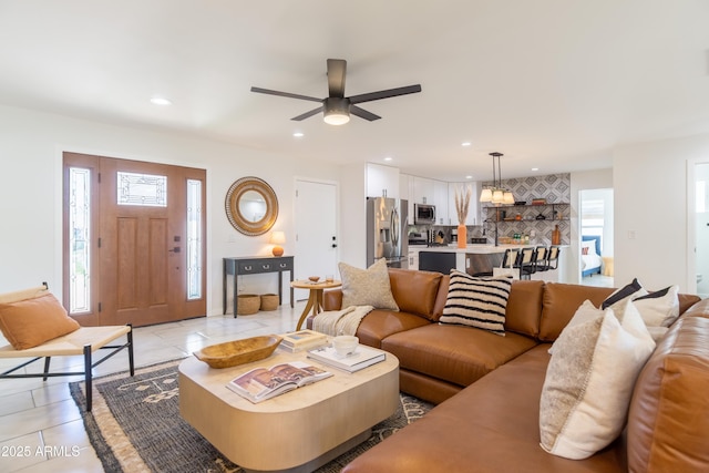6907 E Palm Ln, Scottsdale, AZ 85257 - living area featuring light tile patterned floors, a ceiling fan, and recessed lighting