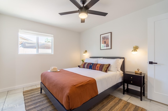 6907 E Palm Ln, Scottsdale, AZ 85257 - bedroom featuring light tile patterned flooring and a ceiling fan