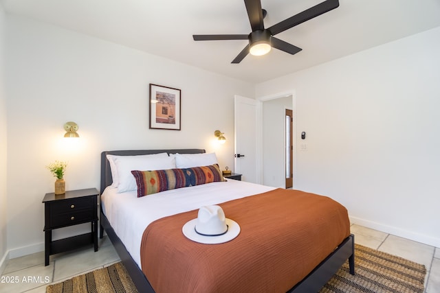 6907 E Palm Ln, Scottsdale, AZ 85257 - bedroom featuring light tile patterned flooring and a ceiling fan