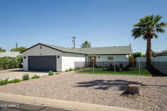 6907 E Palm Ln, Scottsdale, AZ 85257 - single story home featuring a garage, concrete driveway, and stucco siding