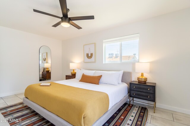 6907 E Palm Ln, Scottsdale, AZ 85257 - bedroom with light tile patterned floors and a ceiling fan