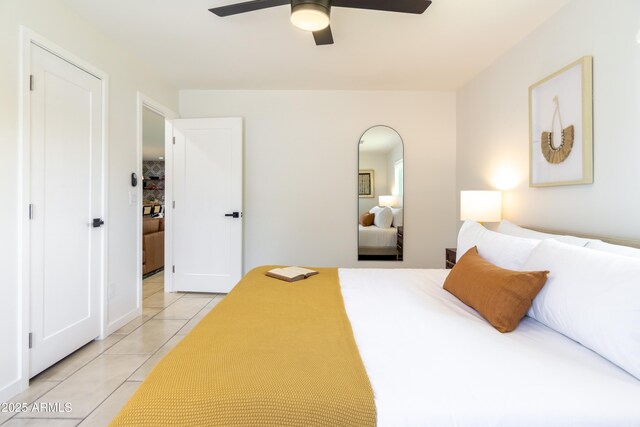 6907 E Palm Ln, Scottsdale, AZ 85257 - bedroom with light tile patterned floors and a ceiling fan