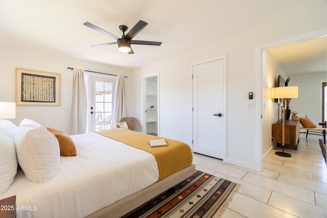 6907 E Palm Ln, Scottsdale, AZ 85257 - bedroom with light tile patterned floors, access to outside, and a ceiling fan