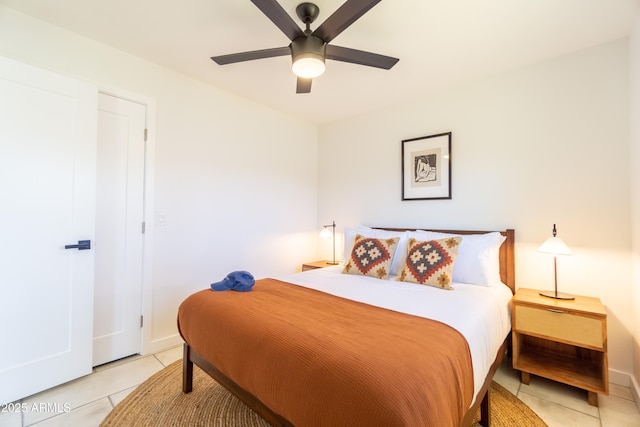 6907 E Palm Ln, Scottsdale, AZ 85257 - bedroom with light tile patterned flooring and a ceiling fan
