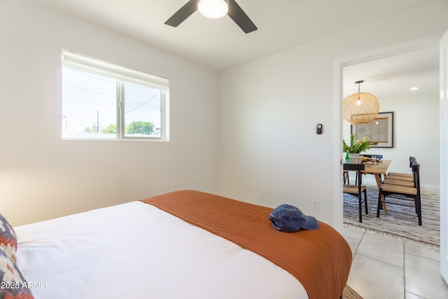 6907 E Palm Ln, Scottsdale, AZ 85257 - bedroom with light tile patterned floors and ceiling fan