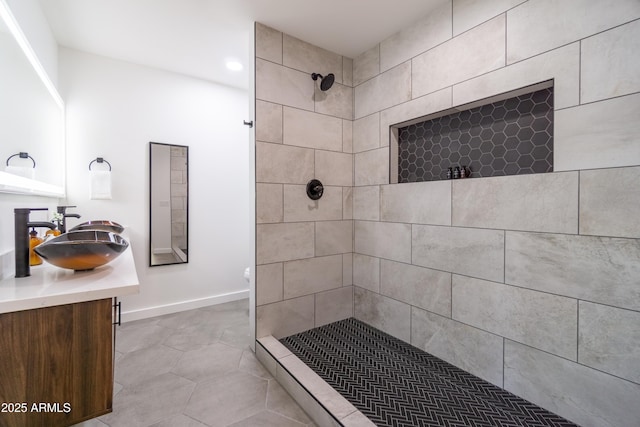 6907 E Palm Ln, Scottsdale, AZ 85257 - full bath featuring tiled shower, vanity, tile patterned flooring, and recessed lighting