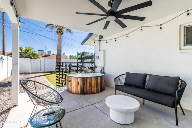 6907 E Palm Ln, Scottsdale, AZ 85257 - fenced backyard featuring a patio, ceiling fan, and an outdoor living space