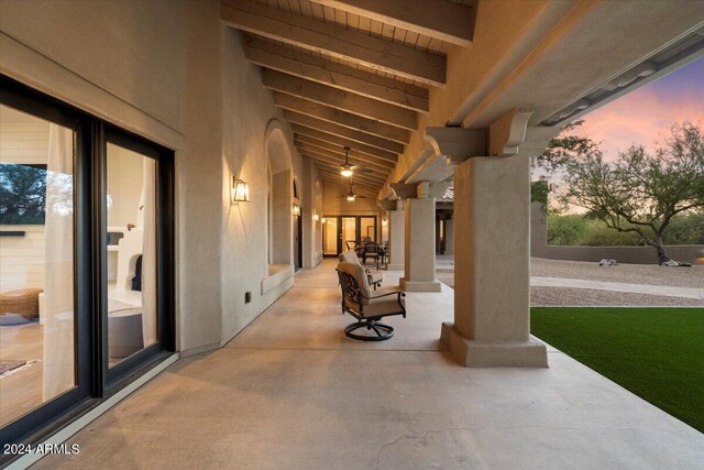 view of patio terrace at dusk