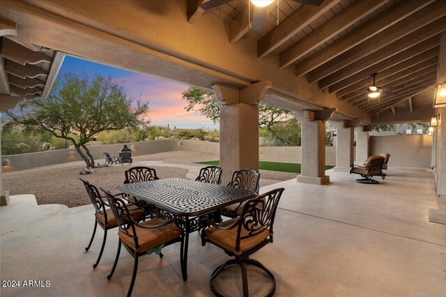 patio terrace at dusk with ceiling fan