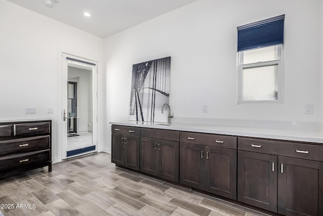 bathroom featuring recessed lighting, vanity, and wood tiled floor