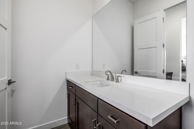 bathroom featuring vanity and baseboards