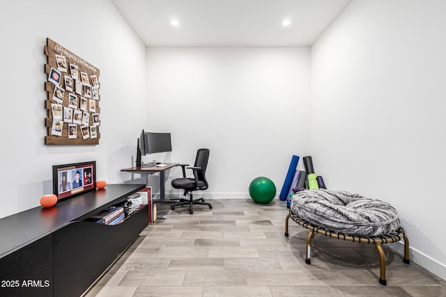 office space with recessed lighting, light wood finished floors, and baseboards