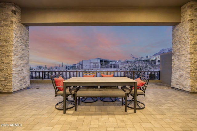 patio terrace at dusk with outdoor dining area