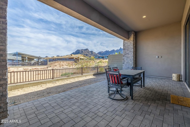 view of patio with a fenced backyard and a mountain view