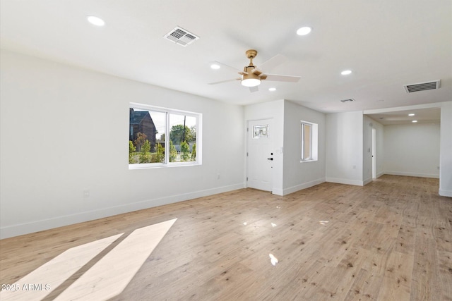 unfurnished living room with light hardwood / wood-style flooring and ceiling fan