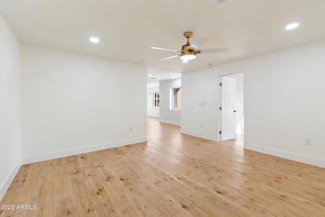 unfurnished room featuring ceiling fan and light hardwood / wood-style floors