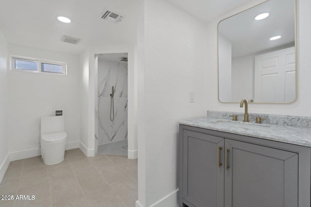 bathroom featuring vanity, a shower, and toilet