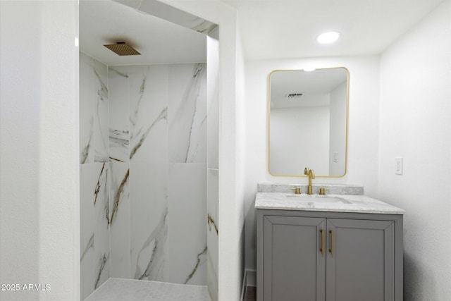 bathroom with vanity and walk in shower