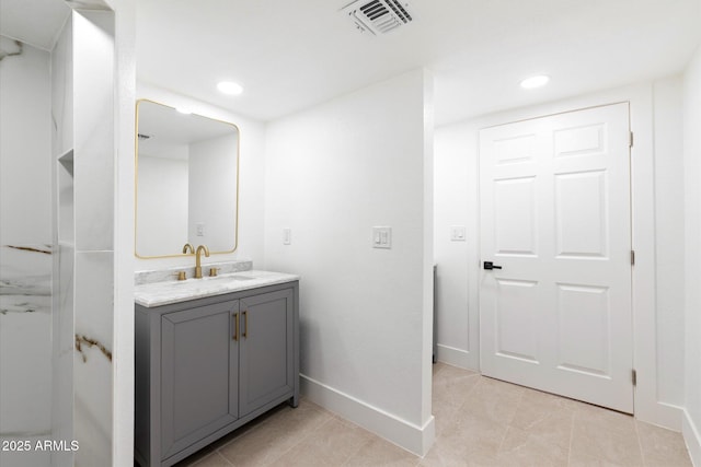 bathroom featuring vanity and tile patterned flooring