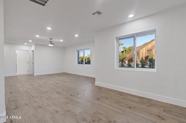 unfurnished room featuring ceiling fan and light wood-type flooring