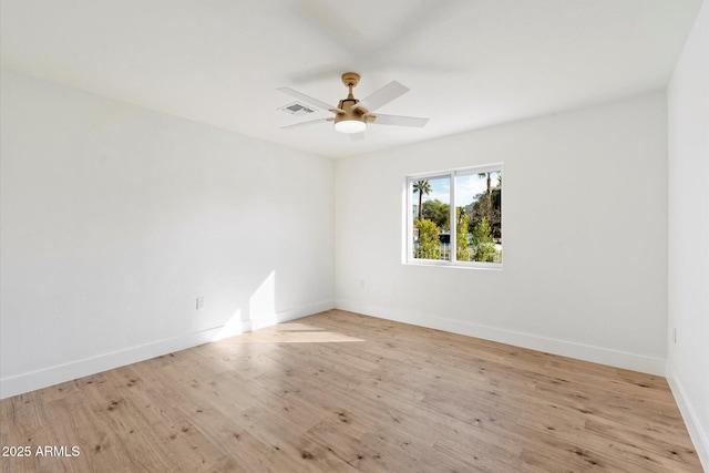 empty room featuring ceiling fan and light hardwood / wood-style flooring