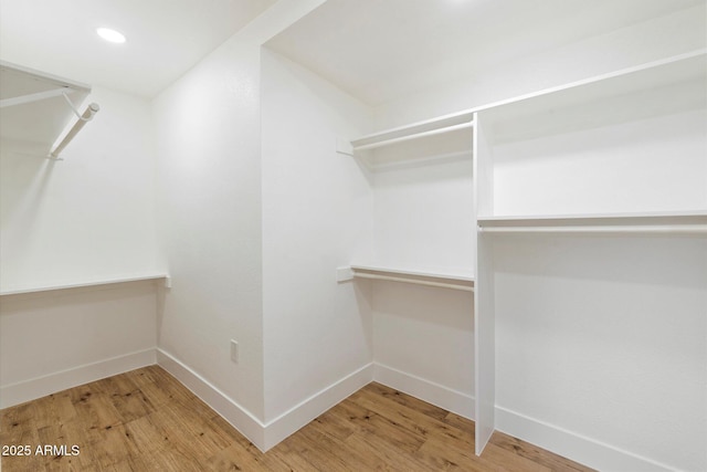 walk in closet featuring hardwood / wood-style floors