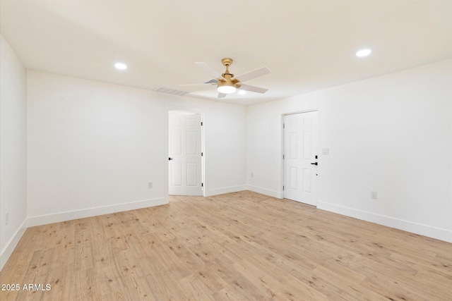 unfurnished room featuring ceiling fan and light hardwood / wood-style flooring