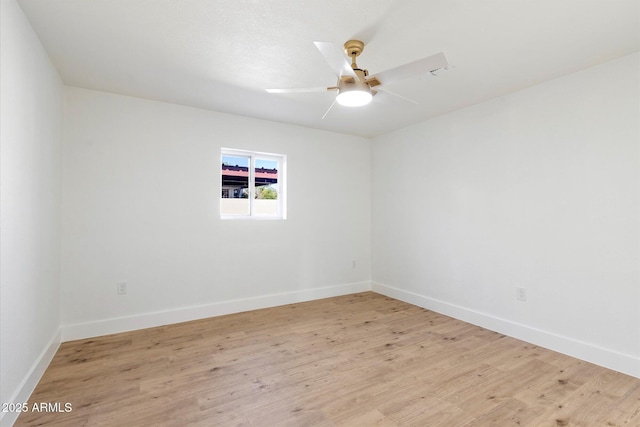 unfurnished room with ceiling fan and light wood-type flooring