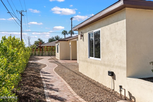 view of side of property featuring a patio