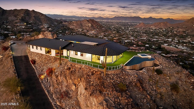 aerial view at dusk with a mountain view