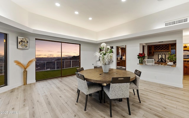 dining area with light hardwood / wood-style flooring